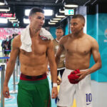 Cristiano Ronaldo of Portugal speaks with Kylian Mbappe of France