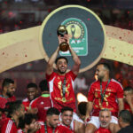 CAIRO, EGYPT - MAY 25: Ahly players celebrate with the winner's trophy after winning the second leg of the CAF Champions League final football match between Egypt's Al-Ahly and Tunis' Esperance Sportive de Tunis at the Cairo International stadium on May 25, 2024 in Cairo, Egypt. (Photo by Ahmad Hasaballah/Getty Images)