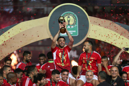 CAIRO, EGYPT - MAY 25: Ahly players celebrate with the winner's trophy after winning the second leg of the CAF Champions League final football match between Egypt's Al-Ahly and Tunis' Esperance Sportive de Tunis at the Cairo International stadium on May 25, 2024 in Cairo, Egypt. (Photo by Ahmad Hasaballah/Getty Images)